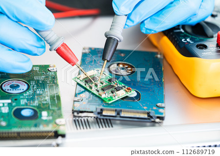 Repairing and upgrade circuit mainboard of notebook, electronic, computer hardware and technology concept. Repairing and upgrade circuit mainboard of notebook, electronic, computer hardware and technology concept. 112689719