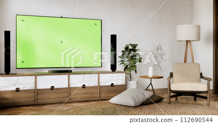Smart Tv Mockup with blank green screen hanging in modern white empty room interior minimal designs. 112690544