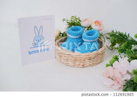 cute baby crochet shoes as a background 112691985
