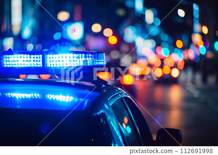 AI-generated content. police car lights at night in city street with selective focus and bokeh 112691998