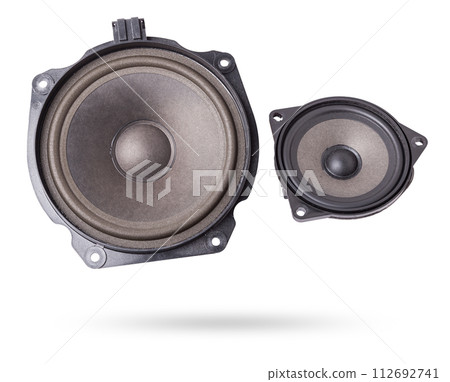 Two speakers of an acoustic system - an audio for playing music in a car interior on a white isolated background in a photo studio. Spare parts for auto repair in a workshop or for sale for tuning 112692741