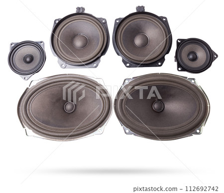 Two speakers of an acoustic system - an audio for playing music in a car interior on a white isolated background in a photo studio. Spare parts for auto repair in a workshop or for sale for tuning Two speakers of an acoustic system - an audio for playing music in a car interior on a white isolated background in a photo studio. Spare parts for auto repair in a workshop or for sale for tuning 112692742