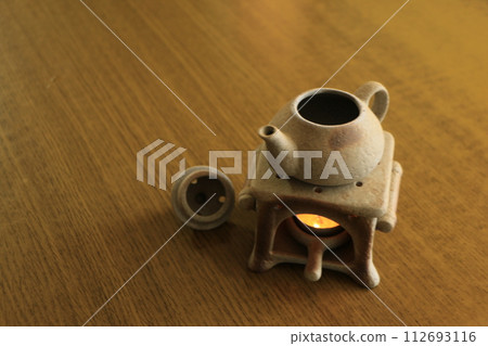 cute incense burner on the table 112693116