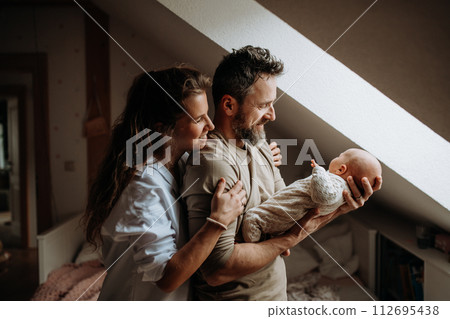 Parents holding newborn baby. Unconditional paternal love, Father's Day and Mather's Day concept. 112695438