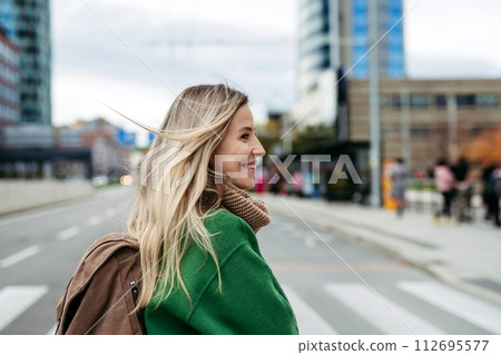 Nurse, doctor walking across city, going to work, hospital, clinic. Work-life balance of healthcare worker. 112695577