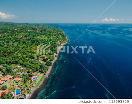 Aerial view of coastline with blue ocean on Northern Bali. Aerial view of coastline with blue ocean on Northern Bali. 112695869
