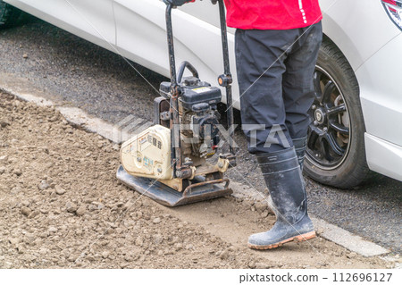 Road construction plate compactor compaction work Road construction plate compactor compaction work 112696127
