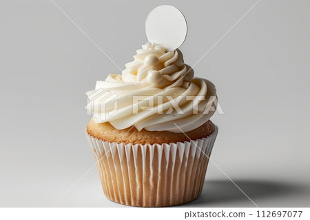 Cupcake with white cream and an inscription plate on a white background Cupcake with white cream and an inscription plate on a white background 112697077