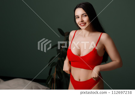 Beauty and fashion . Sexy brunette model on bed Beauty and fashion . Sexy brunette model on bed 112697238