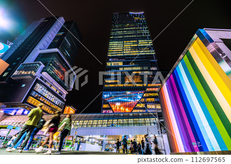 Tokyo cityscape in Japan Shibuya Station elevator transformed into a colorful spring-like design and the station square crowded with tourists Tokyo cityscape in Japan Shibuya Station elevator transformed into a colorful spring-like design and the station square crowded with tourists 112697565