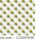 Seamless pattern of sweet rolls with green cream and soft cheese isolated on white background. 112697690