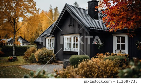 Scandinavian style house. Modern exterior of private house. Rustic architecture with large windows. Autumn season. 112697733