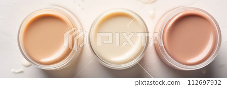 Creamy beige base fair tone product texture. Cosmetic face foundation smears set on white background. Makeup swatch. Trendy self-care procedures. Textured thick cosmetics tonal cream liquid powder Creamy beige base fair tone product texture. Cosmetic face foundation smears set on white background. Makeup swatch. Trendy self-care procedures. Textured thick cosmetics tonal cream liquid powder 112697932