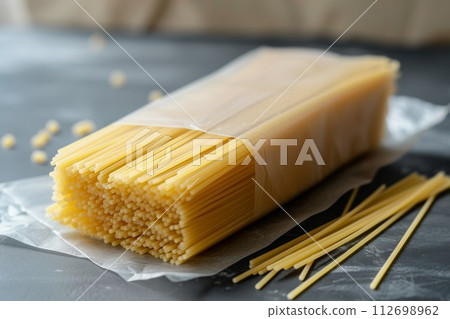 raw whole grain spaghetti on the table 112698962