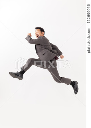 Businessman jump 112699036