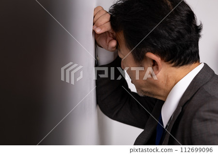 Business man worried Business man worried 112699096