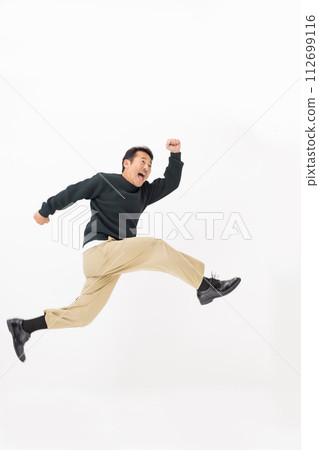 middle-aged man jumping middle-aged man jumping 112699116