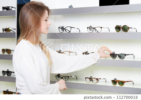 pretty girl buy a new pair of eyeglasses pretty girl buy a new pair of eyeglasses 112700018