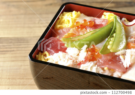 Chirashi sushi with various toppings Chirashi sushi with various toppings 112700498