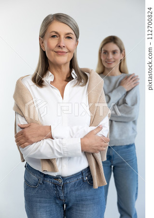 Good-looking mature well-groomed woman with her daughter 112700824
