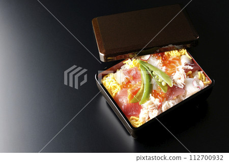 Chirashi sushi with various ingredients taken on a black background Chirashi sushi with various ingredients taken on a black background 112700932
