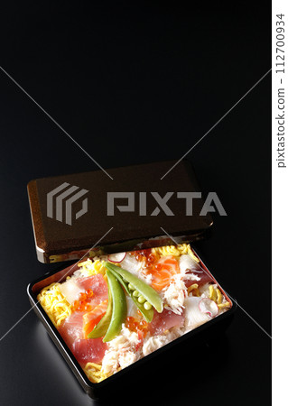 Chirashi sushi with various ingredients taken on a black background 112700934