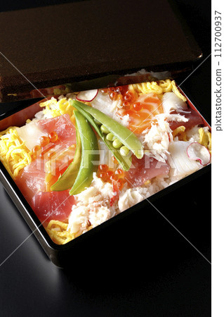 Chirashi sushi with various ingredients taken on a black background 112700937