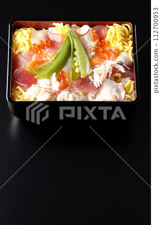 Chirashi sushi with various ingredients taken on a black background Chirashi sushi with various ingredients taken on a black background 112700953