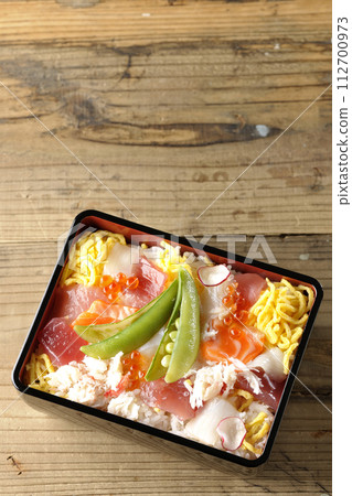 Chirashi sushi with various toppings Chirashi sushi with various toppings 112700973