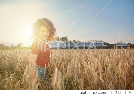 Beautiful woman in the wheat field Beautiful woman in the wheat field 112701169