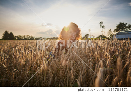 Beautiful woman in the wheat field 112701171