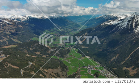 Village in valley and mountain in Alps Village in valley and mountain in Alps 112701372