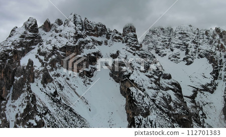 Rocky snow mountains and clouds Rocky snow mountains and clouds 112701383