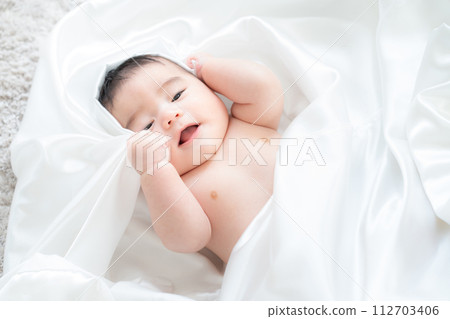 baby wrapped in white sticker baby wrapped in white sticker 112703406