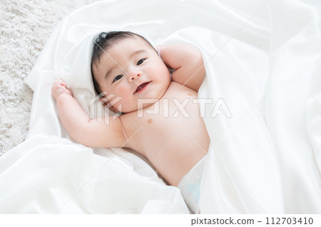 baby wrapped in white sticker baby wrapped in white sticker 112703410