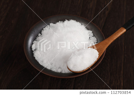 salt on a small plate 112703854