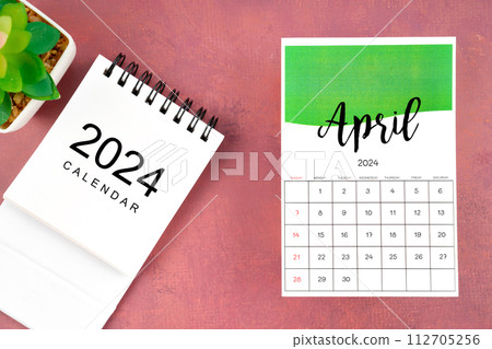 April 2024 calendar page with plant pot on red. 112705256