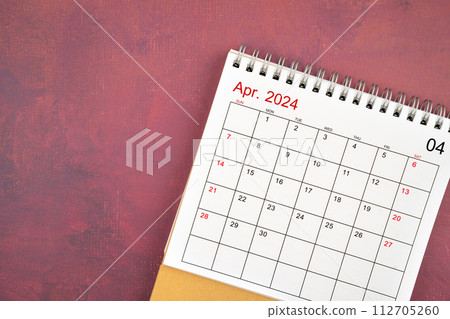 April 2024 desk calendar on red background. April 2024 desk calendar on red background. 112705260
