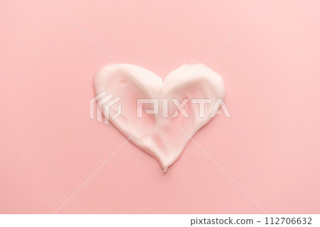 Heart shape skincare cream smear on pink background. Cosmetic lotion swatch texture of face cream, body moisturiser and hair conditioner. Beauty and cosmetic product. Heart shape skincare cream smear on pink background. Cosmetic lotion swatch texture of face cream, body moisturiser and hair conditioner. Beauty and cosmetic product. 112706632
