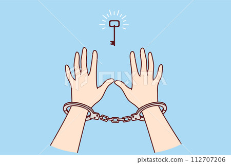 Man in handcuffs reaches for key, wanting freedom, metaphor for solution to problem found Man in handcuffs reaches for key, wanting freedom, metaphor for solution to problem found 112707206