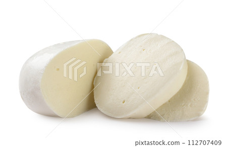 Mozzarella and two pieces close-up on a white. Isolated 112707409