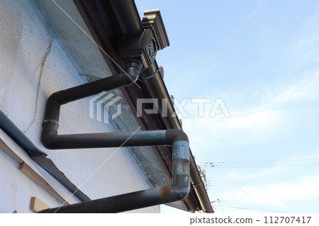rain gutter of old house 112707417
