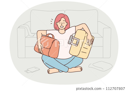 Happy woman excited packing suitcases for holiday Happy woman excited packing suitcases for holiday 112707807