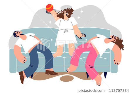 Hyperactive girl jumps on sofa near sleeping mom and dad in need of rest and quiet 112707884