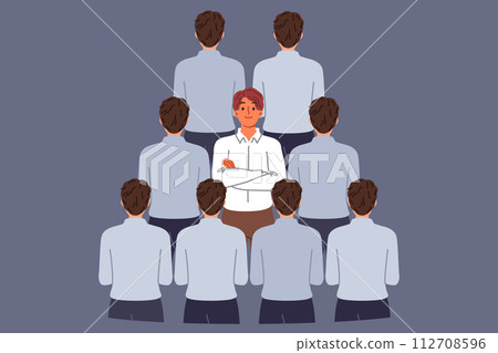 Man stands out from crowd of business colleagues due to individuality or better professional skills 112708596