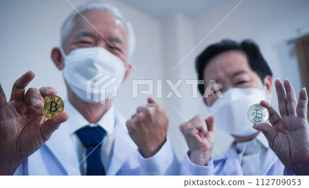 Crypto bitcoin digital currency in research and science technology investment concept Asian scientist 112709053