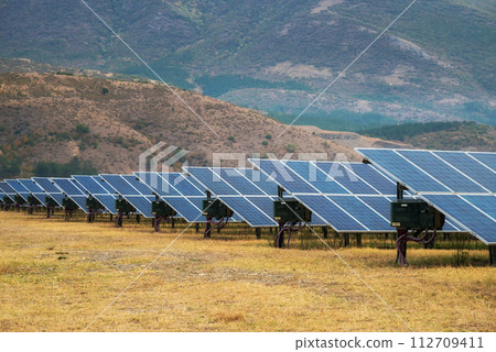 Solar power station. Solar panels, photovoltaics, alternative source of electricity - concept of sustainable and renewable sources. 112709411