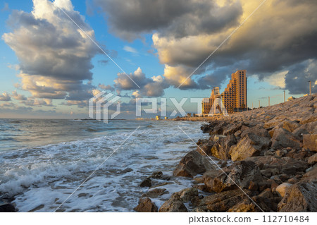 seashore with dramatic clouds at sunset in Haifa seashore with dramatic clouds at sunset in Haifa 112710484