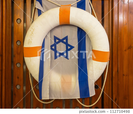 lifebuoy and israel flag on background lifebuoy and israel flag on background 112710498