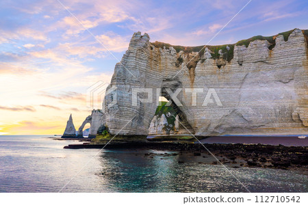 Picturesque panoramic landscape on the cliffs of Etretat. Natural amazing cliffs. Etretat, Normandy, France Picturesque panoramic landscape on the cliffs of Etretat. Natural amazing cliffs. Etretat, Normandy, France 112710542